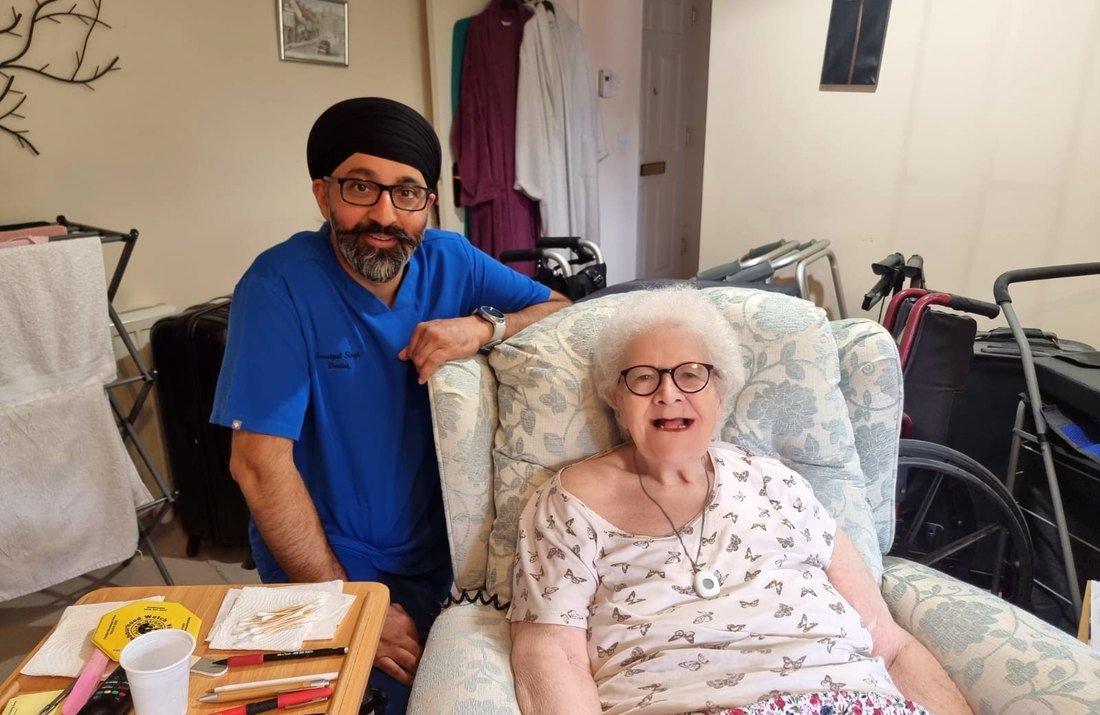 Home visit dentist caring for a patient at home in Leeds